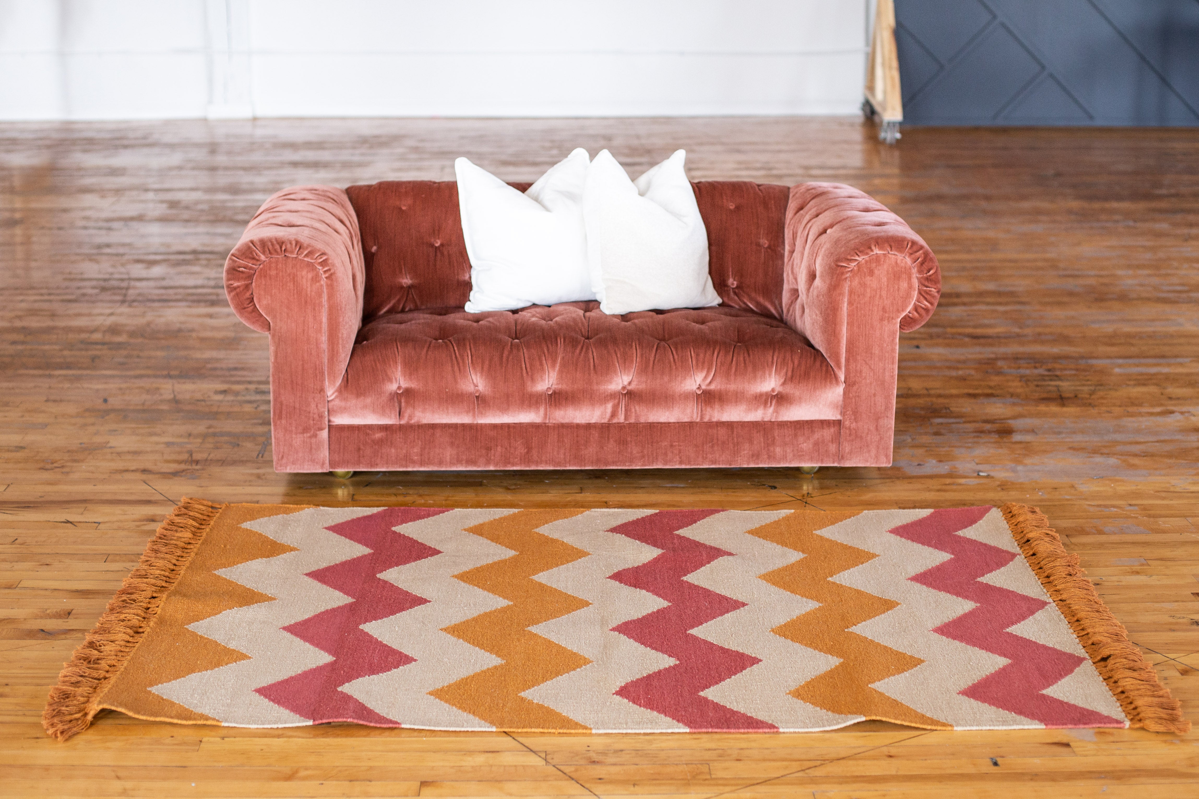 Interior Design velvet couch and bespoke art rug