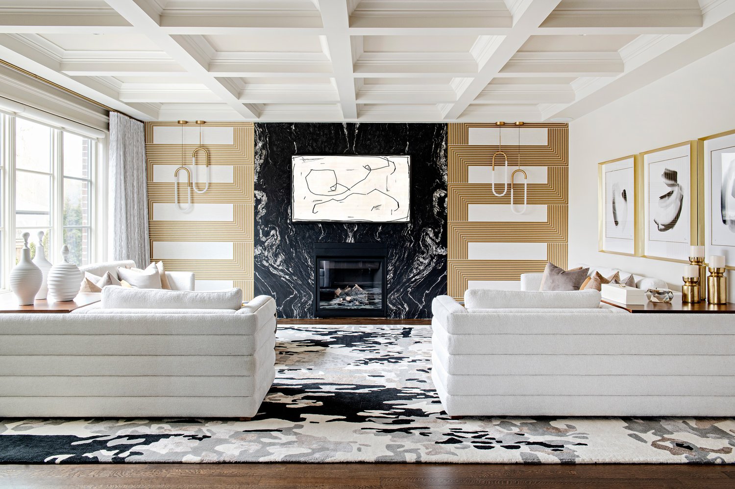Black, white, and grey contemporary style rug in a modern living space with white couches and black, gold, and white decor. Area rug created in Toronto by Studio321B.