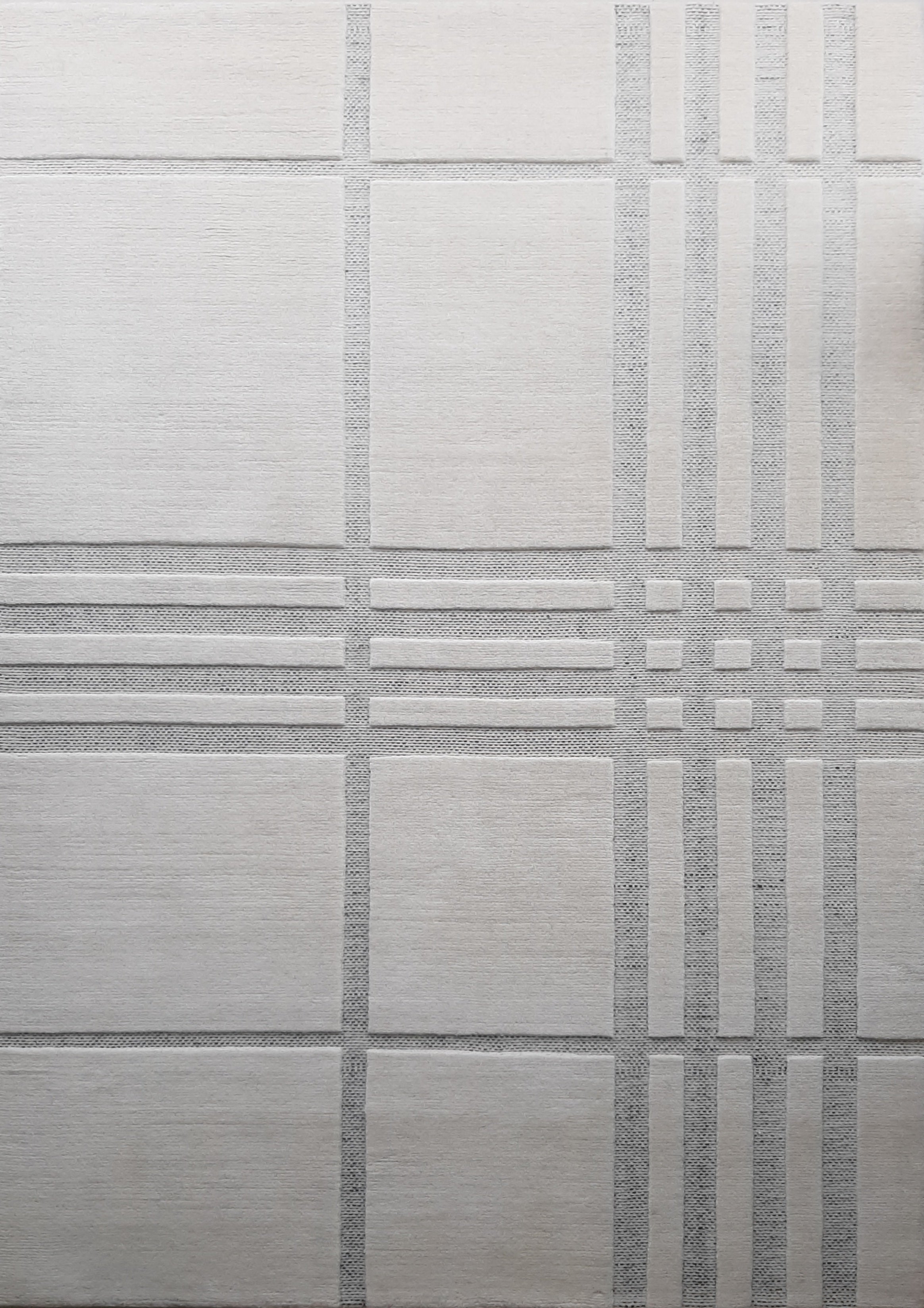 English Wool Rug with patterned tile design in an off-white color. Created by Studio 321B Toronto.