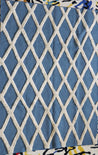 Studio 321B Embossed Lattice Rug. Teal blue rug with white diamond pattern.